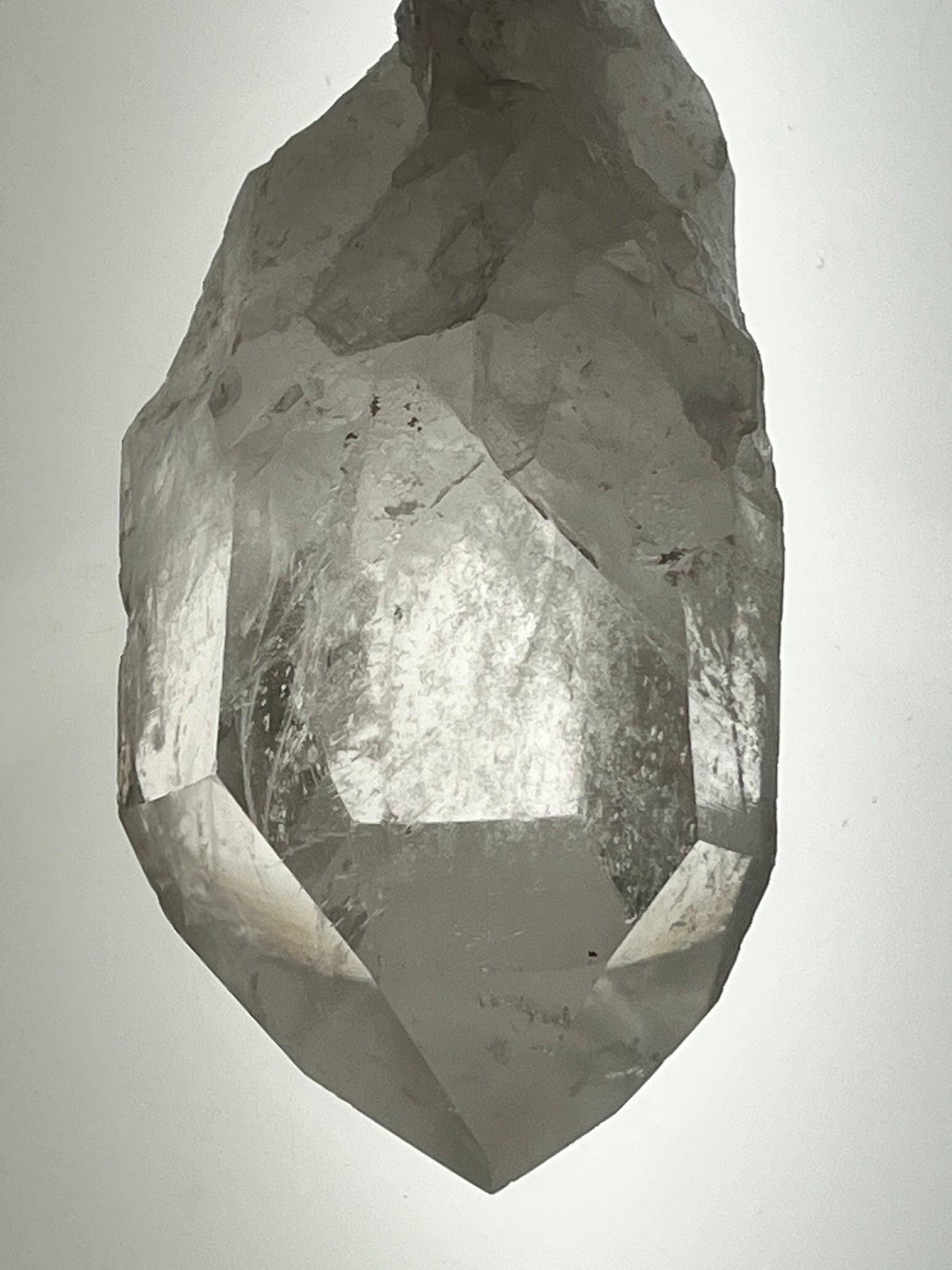 A stunning display of various Quartz varieties, featuring a Columbian Quartz Pencil Wand known for clear water qualities, perfect for spiritual healing and meditation.