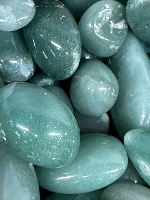 A stunning display of the I Am Enough crystal kit showcasing stones like Aventurine and Black Onyx.