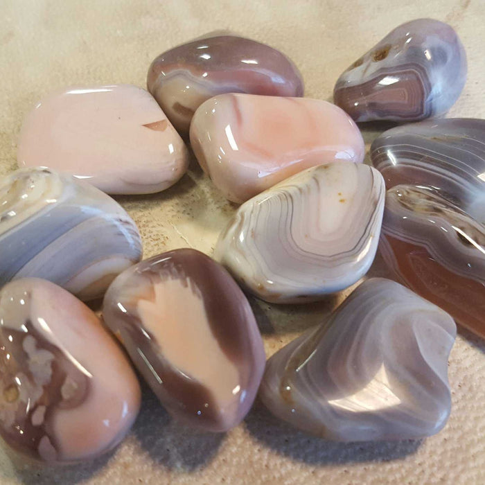 Pink Botswana Agate Tumbled Stone for Root Chakra - Collection of Pink Botswana Agate tumbled stones, perfect for meditation and emotional support.