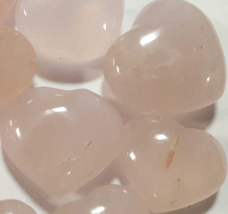 Beautiful polished Rose Quartz in the shape of hearts, showcasing the Polished Hearts Medium - Rose Quartz that resonates with unconditional love and enhances the heart chakra.