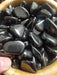 Tumbled Stones - Shungite tumbled, showcasing the unique black and silver energy stone, known for its healing properties and ability to purify water.