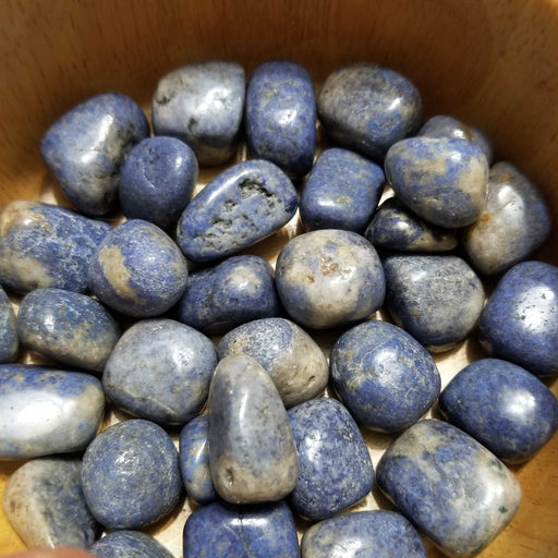 Natural Blue Dumortierite Quartz stones showcasing beautiful blue hues, perfect for promoting patience and self-assertiveness.