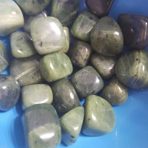 Close-up of Tumbled Stones - Nephrite Jade Tumbled, highlighting its serene green hues and healing properties.