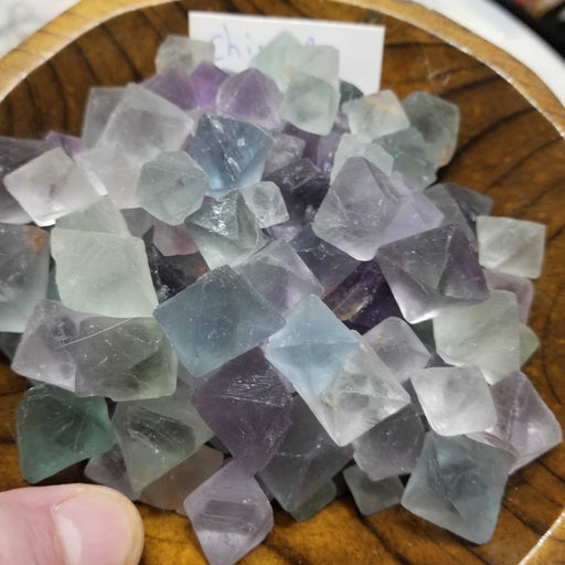 Stunning display of Fluorite Octahedrons highlighting their unique cube shape and natural cleavage.