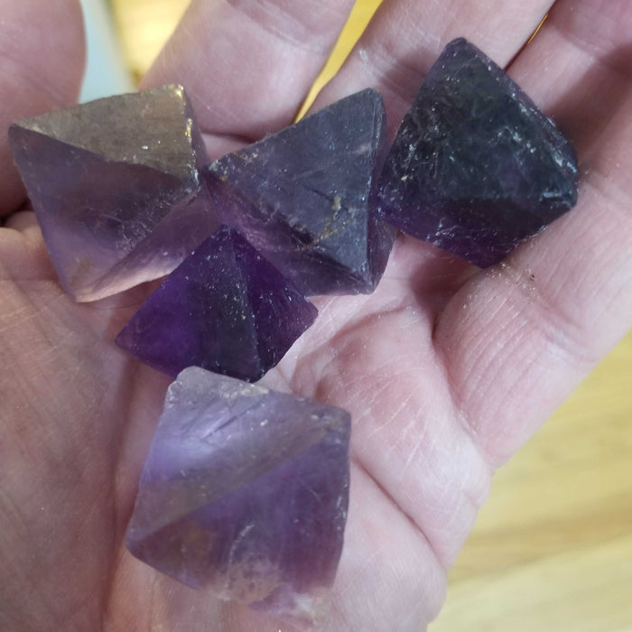 Fluorite Octahedrons Purple crystal showcasing a dark purple color, unpolished and cube-shaped for healing and spiritual harmony.
