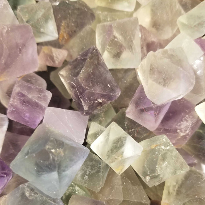 Beautiful Fluorite Octahedrons from China showcasing a variety of colors including white, green, and purple.