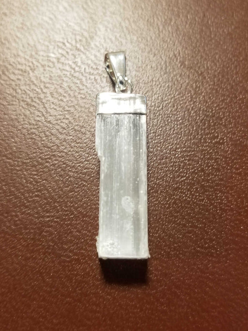 Selenite Pendant Silver capped - polished selenite pendant with silver clasp, approximately 1 inch long.