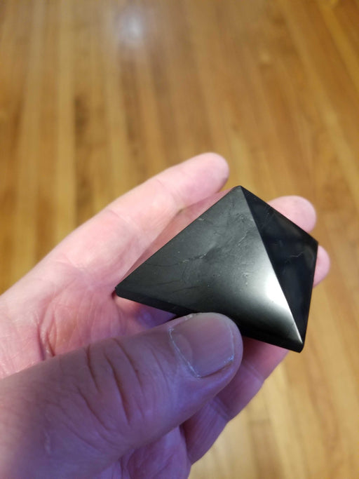Shungite - Pyramid with a description of its electromagnetic field reduction properties.