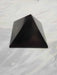 Shungite - Pyramid with various sizes available, showcasing its radius of action for EMF protection.