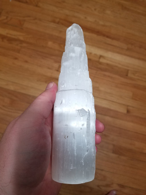 Selenite Tower from High Ho Gems and Crystals, showcasing a raw carved satin spar tower perfect for meditation and home decor.