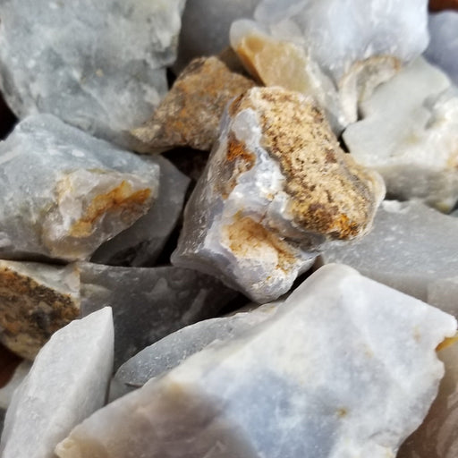 Blue Chalcedony Raw stone, showcasing its bluish gray color and natural texture, ideal for crystal healing and decorative purposes.