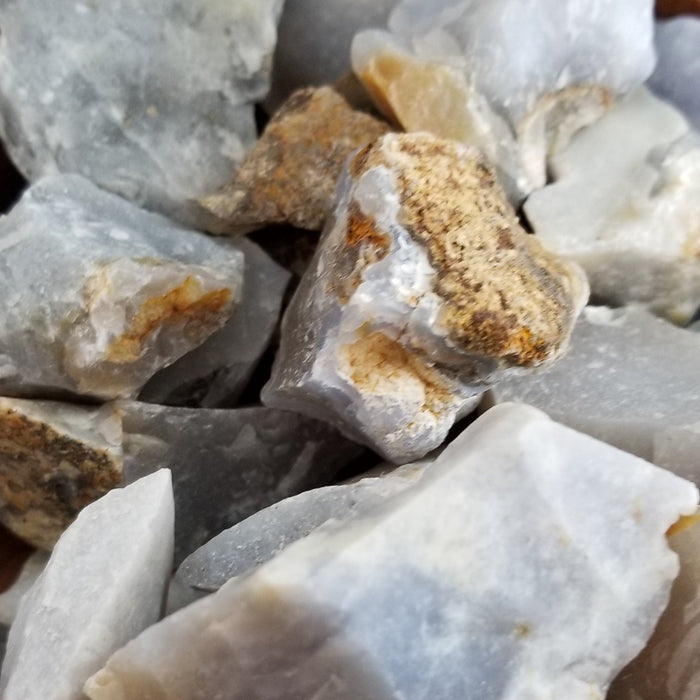 Blue Chalcedony Raw stone, showcasing its bluish gray color and natural texture, ideal for crystal healing and decorative purposes.