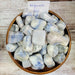 Afghanite: The Celestial Blue Stone of Intuition and Clarity, featuring stunning Afghanite Tumbled crystals showcasing their rich celestial blue hues and unique textures.