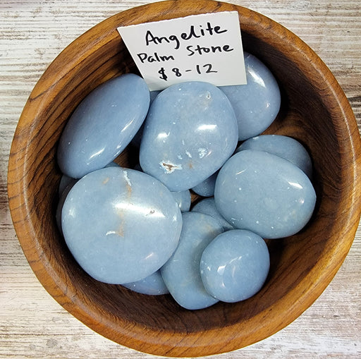 Stunning light blue Angelite Palm stones by High Ho Gems and Crystals, perfect for calming and enhancing communication.