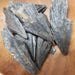Black Kayanite raw mineral displaying its unique black color and natural crystal formations, known for its healing properties and chakra balancing abilities.