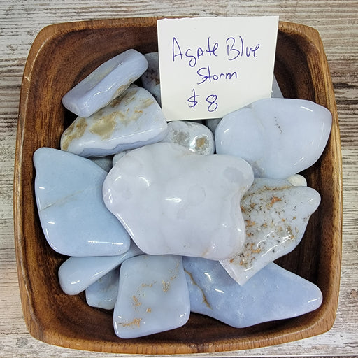 Beautiful Blue Storm Agate showcasing deep blue tones with banding, known for promoting inner peace and focus.
