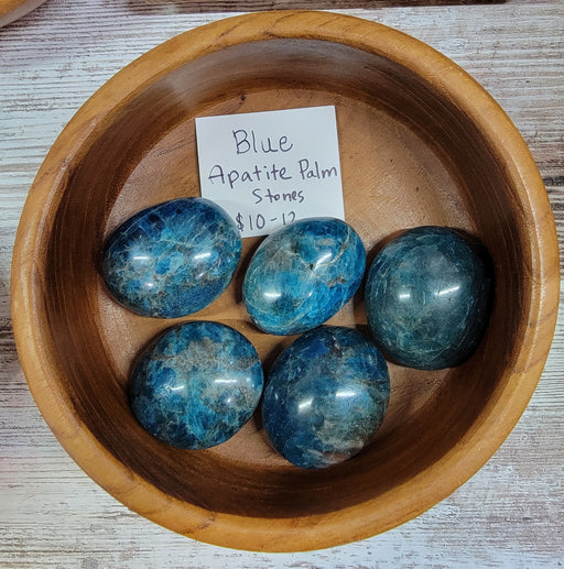 Blue Apatite tumbled stone, known for its spiritual cleansing properties and aiding creativity, ideal for throat chakra support.
