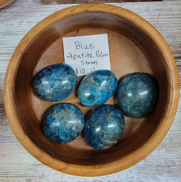 Blue Apatite tumbled stone, known for its spiritual cleansing properties and aiding creativity, ideal for throat chakra support.