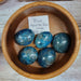 Blue Apatite tumbled stone, known for its spiritual cleansing properties and aiding creativity, ideal for throat chakra support.