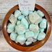 Beautiful Blue Aragonite tumbled stones showcasing vibrant turquoise water blue hues, known for their joyful vibration and ability to enhance communication and empathy.