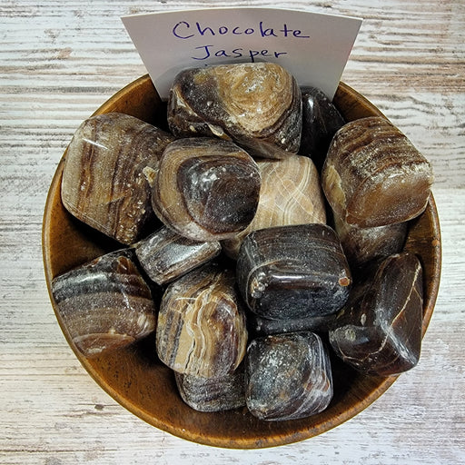 Beautiful collection of Chocolate Jasper tumbled stones, emphasizing their grounding properties and smooth surfaces, perfect for crystal enthusiasts.