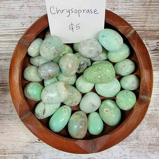 Chrysoprase Tumbled stones featuring vibrant apple green colors, known for promoting joy, happiness, and detoxifying properties.