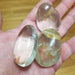 Clear Quartz palm stone from High Ho Gems and Crystals, showcasing its beautiful clarity and natural sparkle.
