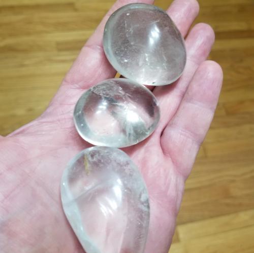 High Ho Gems and Crystals Clear Quartz palm stone, a master healer that amplifies energy and intentions.
