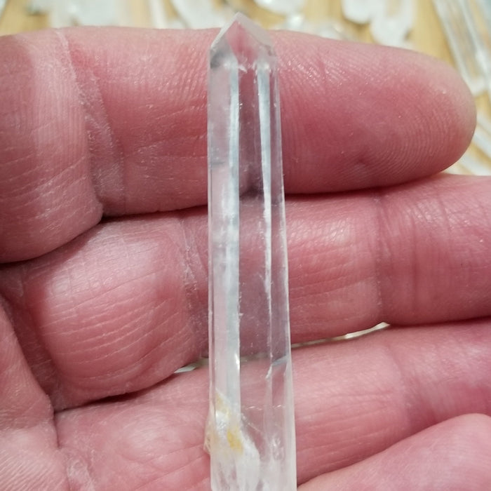 Beautiful Columbian Quartz Pencil, highlighting its crystal structure and shiny aesthetic.