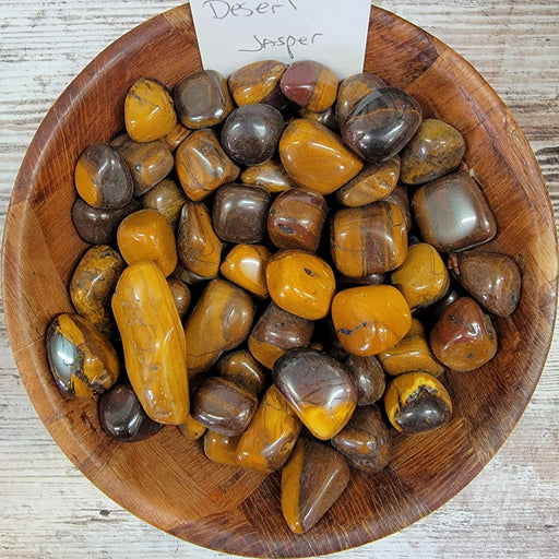 Tumbled Stones - Desert Jasper Tumbled shown in a natural setting, highlighting their earthy colors and unique textures.