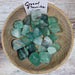 Tumbled stones - Fluorite Green from India, showcasing their vibrant green color and unique textures, known for their grounding energy and healing properties.