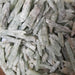 Close-up view of Green Kayanite raw mineral showcasing its vibrant green color and natural texture, perfect for chakra healing and spiritual growth.