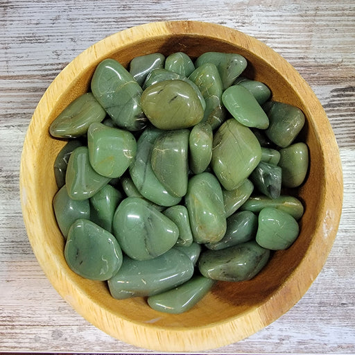 Tumbled stones of Green Chalcedony from High Ho Gems and Crystals, showcasing their vibrant green color and natural beauty.