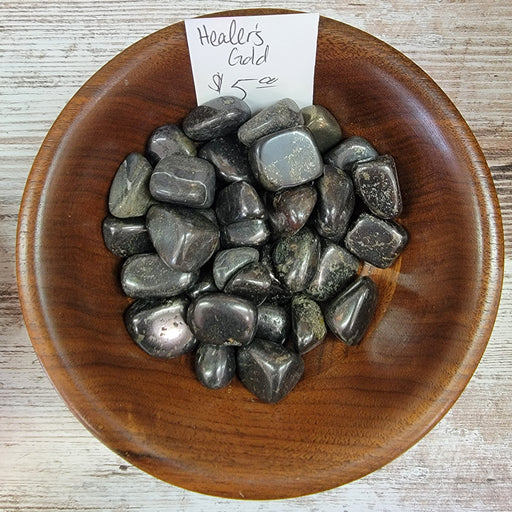 Healers Gold tumbled stones by High Ho Gems and Crystals, showcasing black and gold hues, embodying the protective and re-energizing properties of pyrite and magnetite.