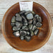 Healers Gold tumbled stones by High Ho Gems and Crystals, showcasing black and gold hues, embodying the protective and re-energizing properties of pyrite and magnetite.
