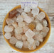 Hematoid Quartz tumbled stones showcasing vibrant reddish brown and yellow colors, perfect for enhancing self-worth and stability.