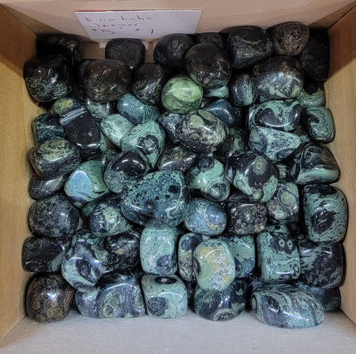 Kambaba Jasper tumbled stones showcasing their unique green and black swirls, perfect for those seeking peace, tranquility, and balance.