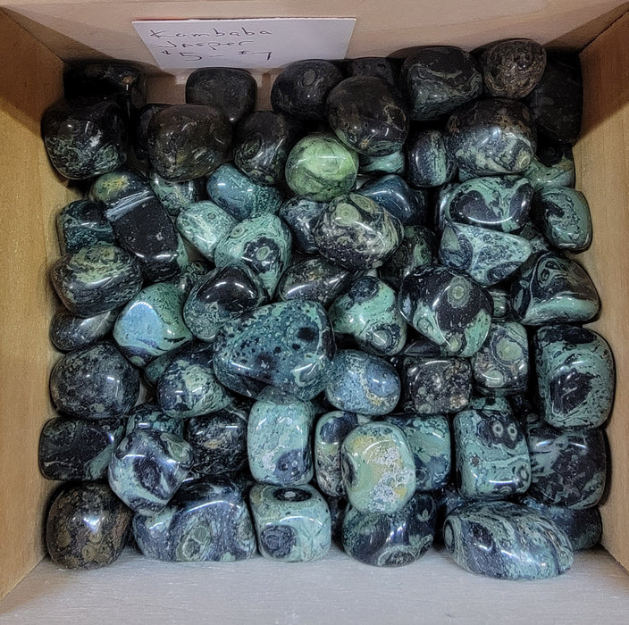 Kambaba Jasper tumbled stones showcasing their unique green and black swirls, perfect for those seeking peace, tranquility, and balance.
