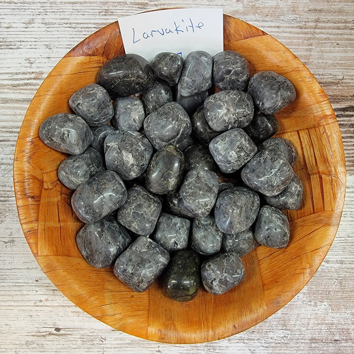 High-quality Larvakite tumbled stones showcasing turquoise water blue hues, perfect for grounding and energy cleansing.