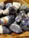 A beautiful Sodalite tumbled large stone showcasing vibrant blue and white hues, perfect for enhancing intuition and emotional balance.