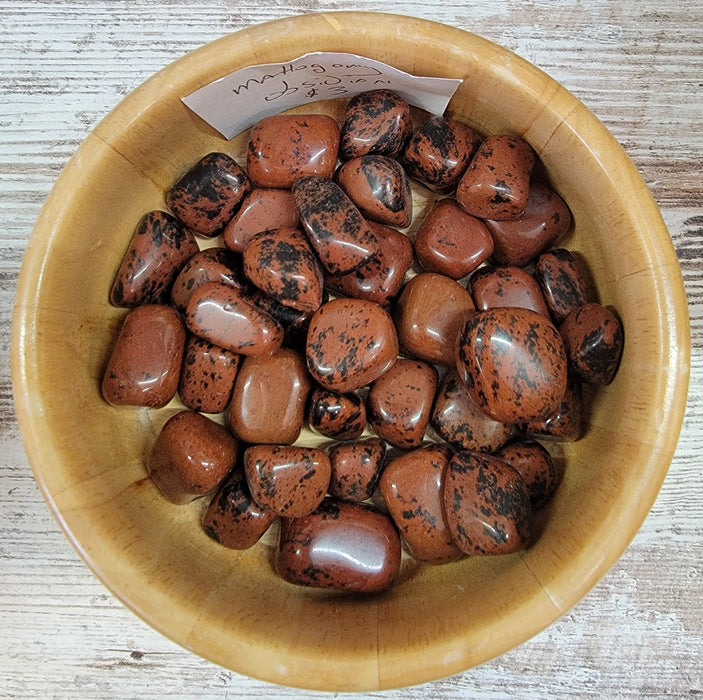 Mahogany Obsidian tumbled stones showcasing rich mahogany colors, perfect for crystal healing and aura strengthening.