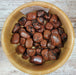 Mahogany Obsidian tumbled stones showcasing rich mahogany colors, perfect for crystal healing and aura strengthening.