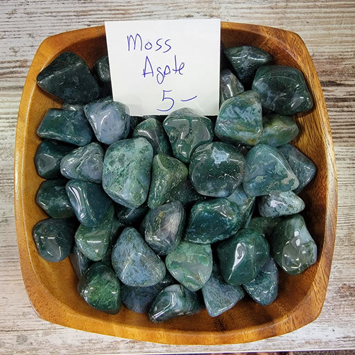 Moss Agate tumbled stone showcasing its natural beauty and unique patterns, perfect for crystal healing and decoration.