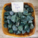 Moss Agate tumbled stone showcasing its natural beauty and unique patterns, perfect for crystal healing and decoration.
