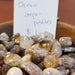 Beautiful Tumbled stones - Ocean Jasper Pebbles in various colors such as green, yellow, brown, and pink, ideal for inducing tranquility and eliminating negative energy.