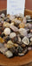 Close-up of Ocean Jasper Palm stones highlighting unique patterns and colors like green, yellow, and brown, perfect for chakra healing and meditation.