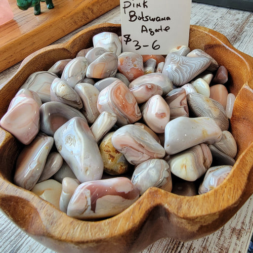 Pink Botswana Agate Tumbled Stone for Root Chakra - A beautifully soothing and unique Pink Botswana Agate tumbled stone showcasing its pink, brown, and gray hues.