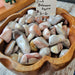 Pink Botswana Agate Tumbled Stone for Root Chakra - A beautifully soothing and unique Pink Botswana Agate tumbled stone showcasing its pink, brown, and gray hues.