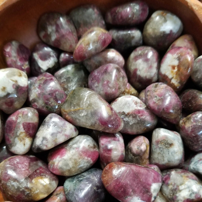 Beautiful Pink Tourmaline Tumbled stones showcasing their unique pink hues and natural patterns, ideal for emotional healing and self-love practices.