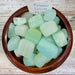 Beautiful tumbled stones of Pistacio Calcite Tumbled, featuring large to extra-large light green pieces, perfect for the heart chakra.